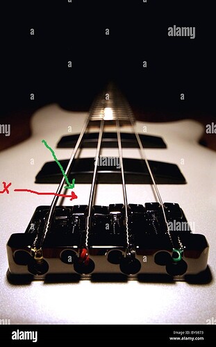 white-bass-guitar-looking-down-the-strings-with-a-shallow-dof-BY9873